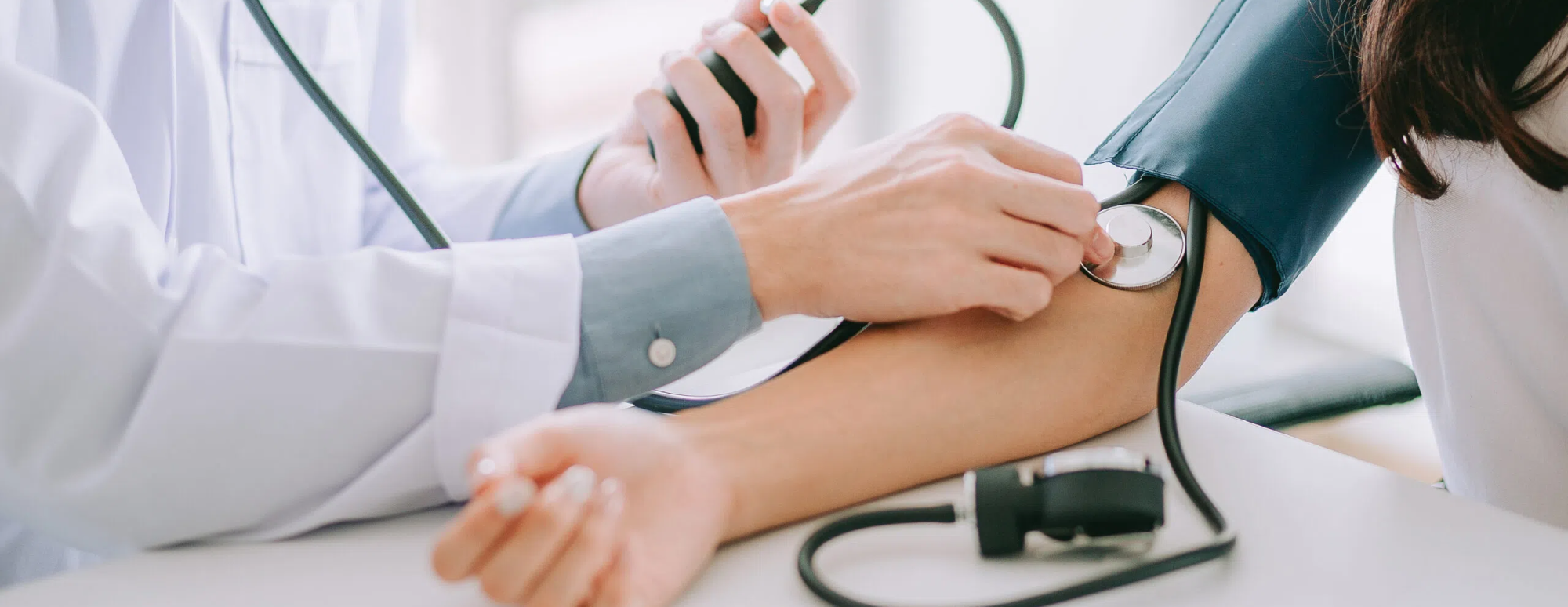 doctor checking heartbeat