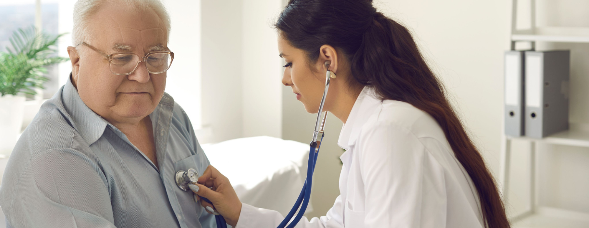 doctor checking heartbeat on potential cardiomyopathy patient